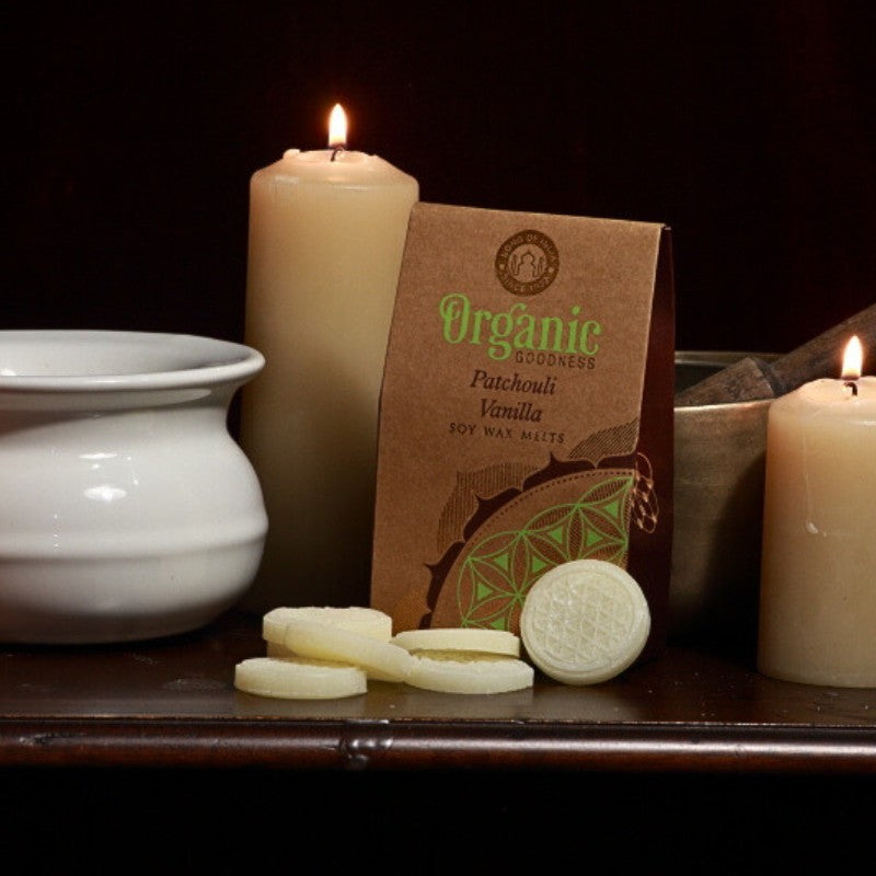 pack of organic goodness wax melts, wax melts in front of a singing bowl, beeswax candles and oil burner