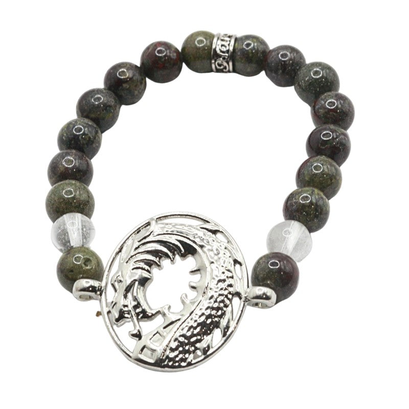 Bracelet with dark beads and a silver circular pendant on a white background