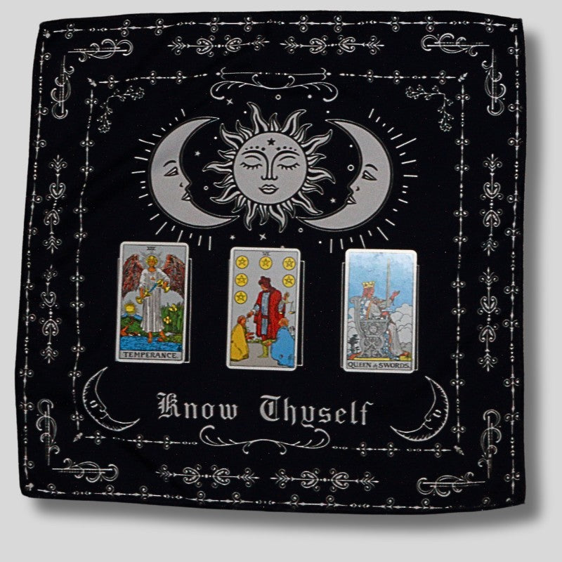 3 card spread laid out on a black and white tarot cloth