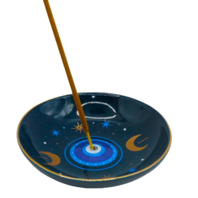 Incense burner with a evil eye design on a white background