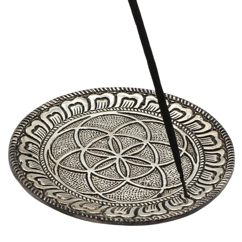 aluminium incense burner with seed of life design holding an incense stick