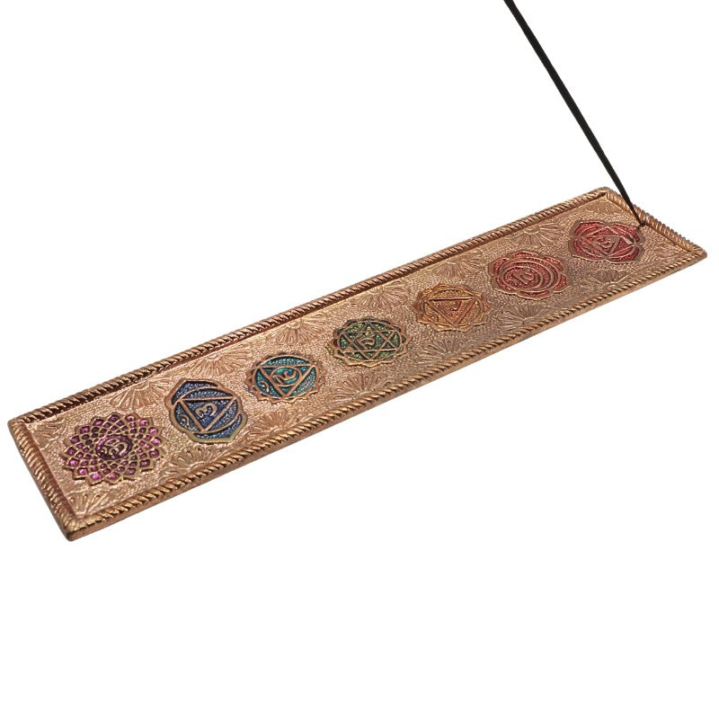 incense stick in a Flat aluminium incense burner with colourful chakra symbols on top