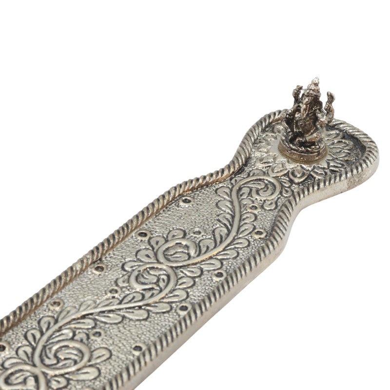 incense stick in an aluminium incense burner