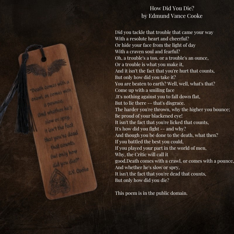 handmade wooden bookmark with black tassel next to a poem