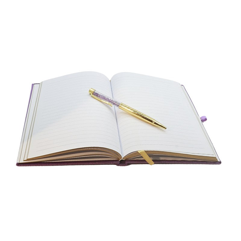 lined paper inside Purple Book of spells journal with amethyst chip gold pen