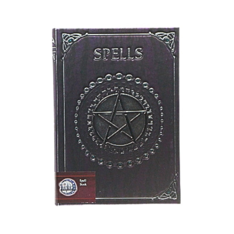 purple notebook with 'Spells' text and pentagram design on a white background