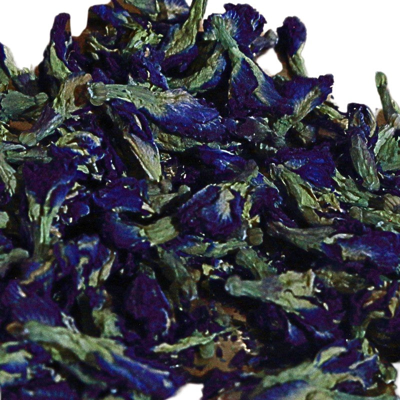 Close-up of dried blue butterfly pea flowers on a white background