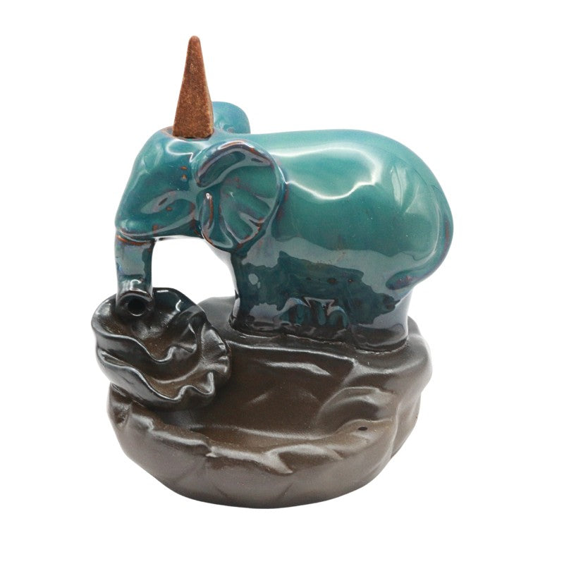 Ceramic elephant figurine with a brown trunk on a white background