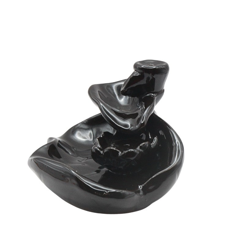 Black ceramic incense burner on a white background