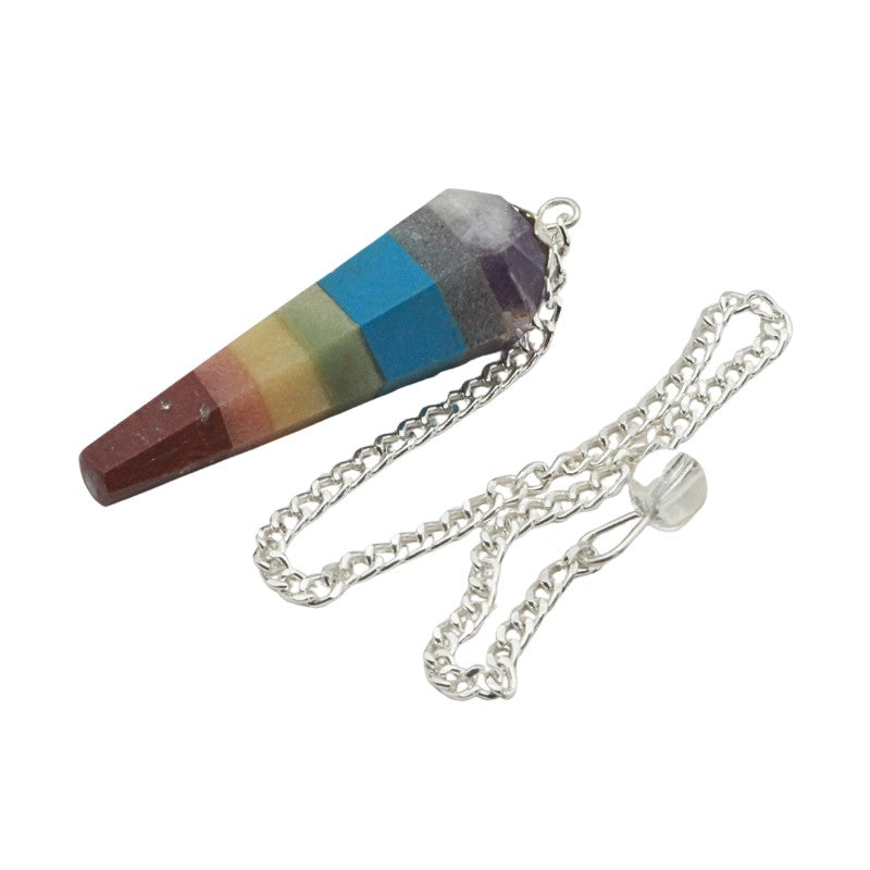 Colourful crystal pendulum with a silver chain on a white background