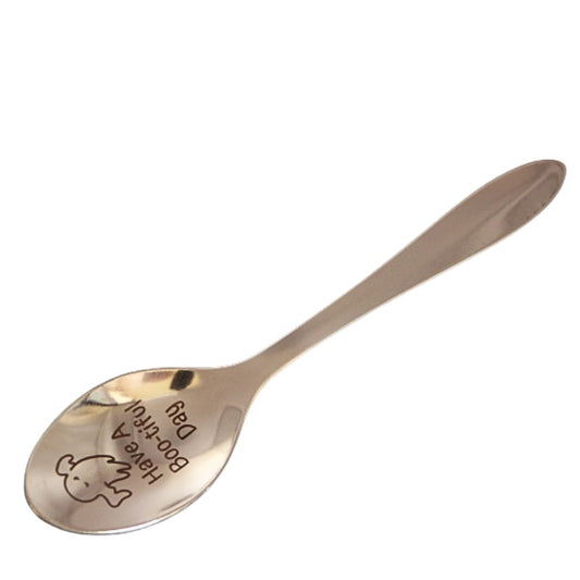 stainless steel teaspoon with "have a boo-tiful day" and a ghost engraved in the dish