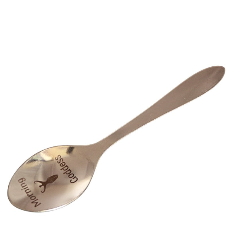 stainless steel teaspoon with "Morning Goddess" and a spiral goddess  engraved in the dish