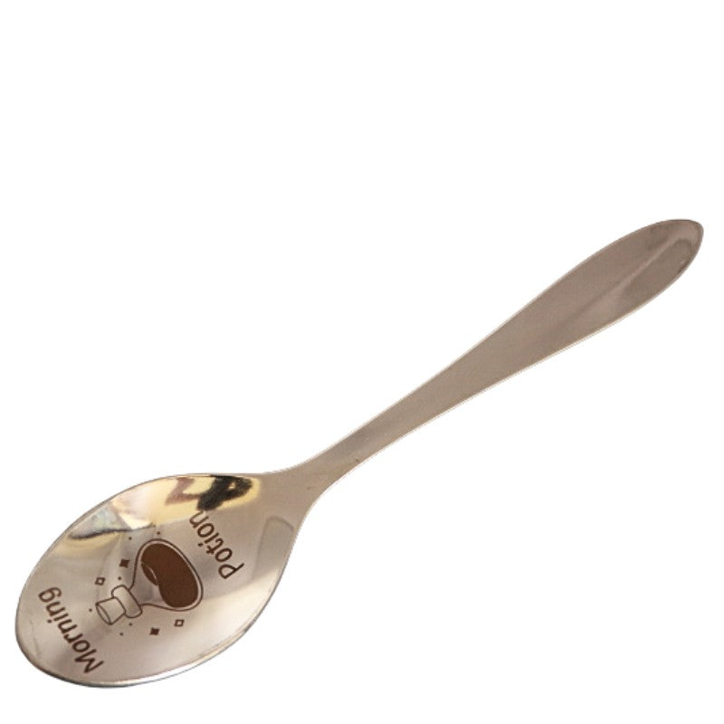 stainless steel teaspoon with "morning potion" and a potion bottle engraved in the dish