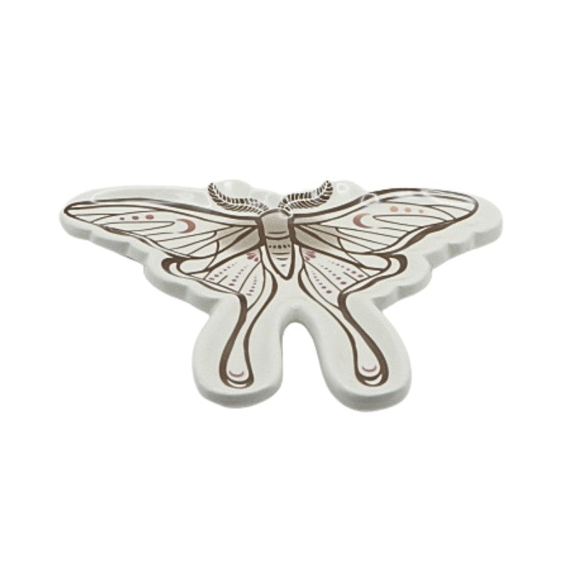 Butterfly-shaped ceramic trinket dish on a white background