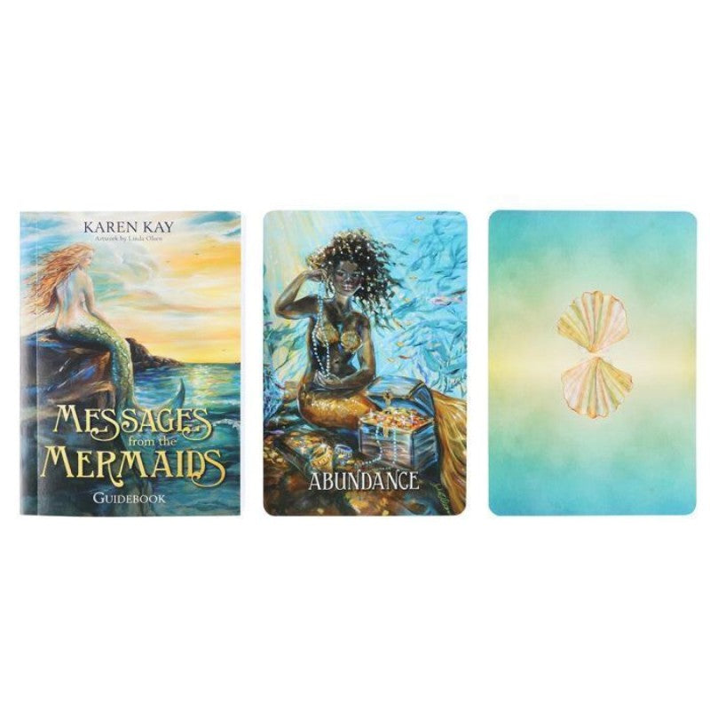 front cover of the messages from the mermaids guidebook next to the ' abundance' card from the deck and a card turned over, showing the back of the card featuring a seashell