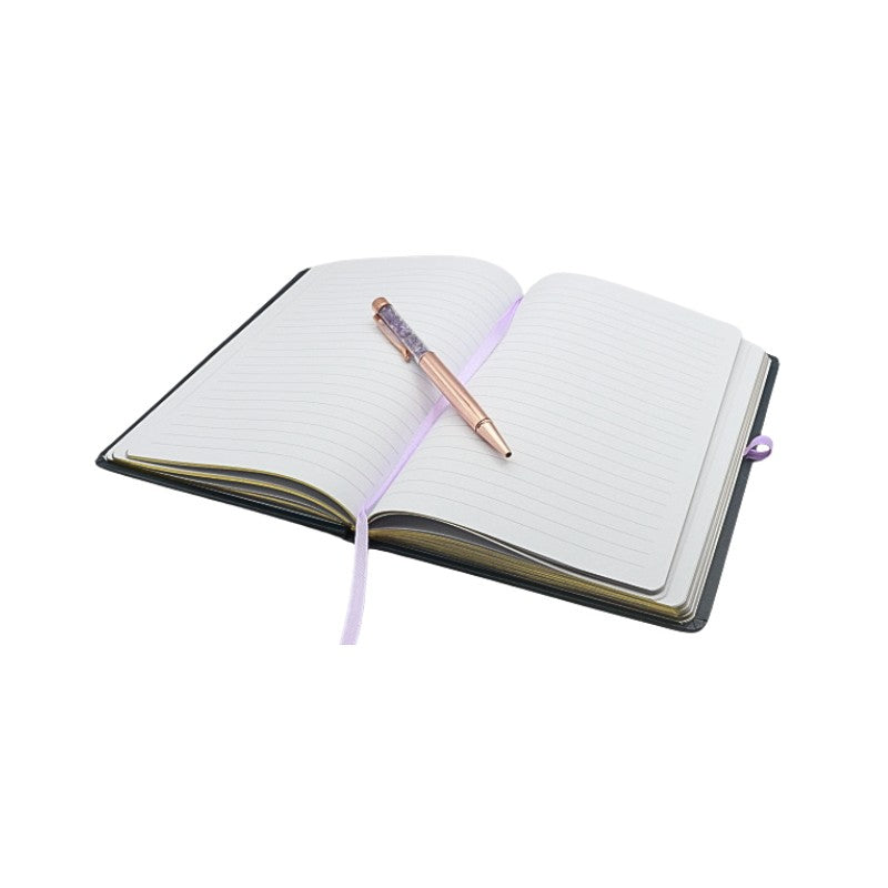 Open notebook with a pen on a white background