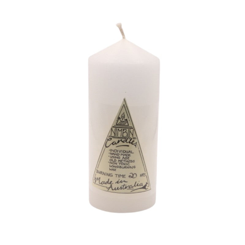 a white pillar candle with a triangle label on the front
