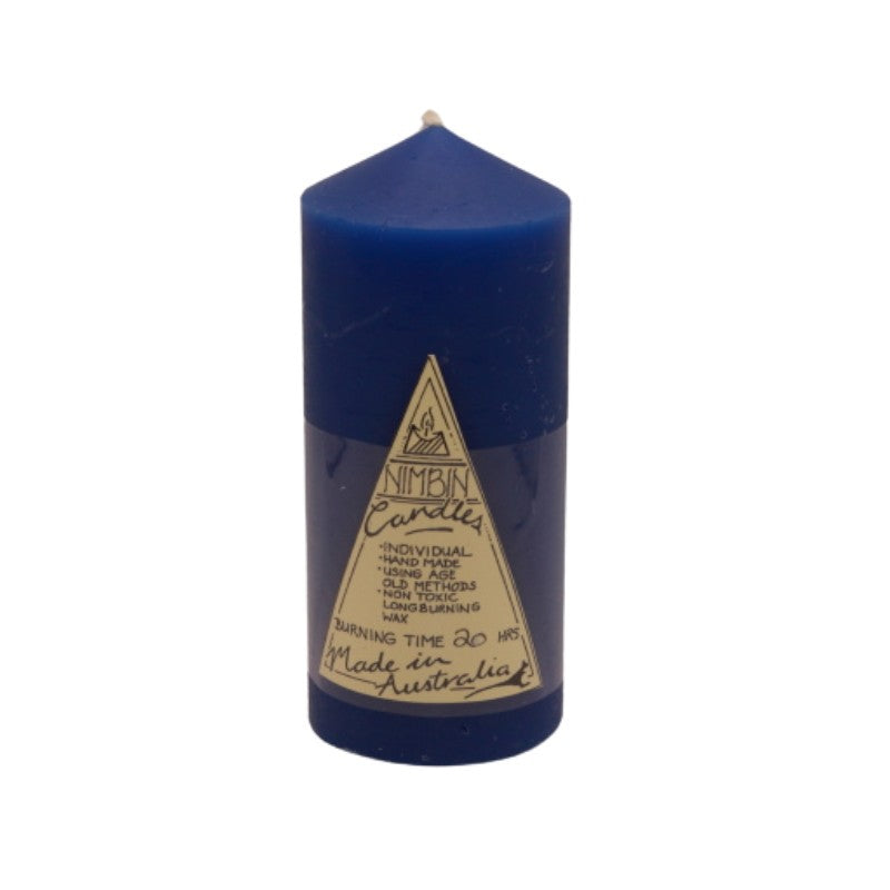 a blue pillar candle with a triangle label on the front