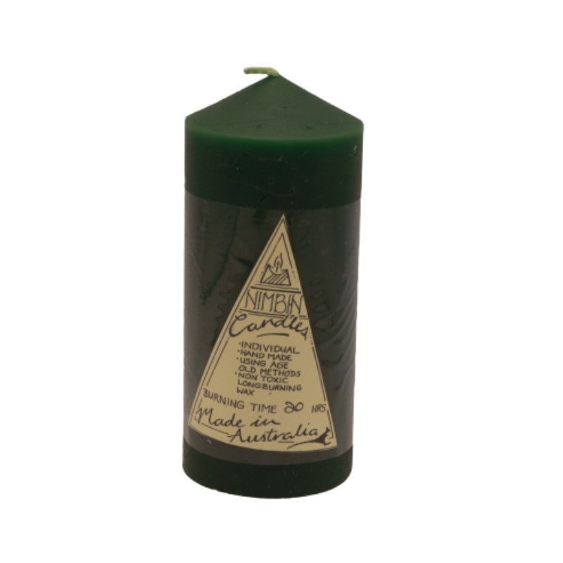a green pillar candle with a triangle label on the front