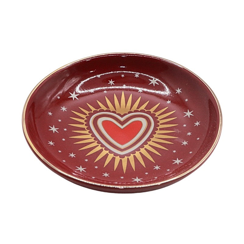 Red ceramic plate with a heart design on a white background