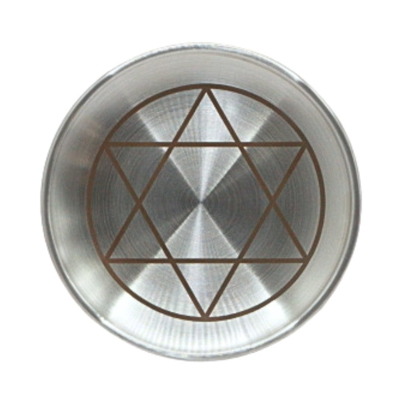 Metallic plate with star of david design on a white background