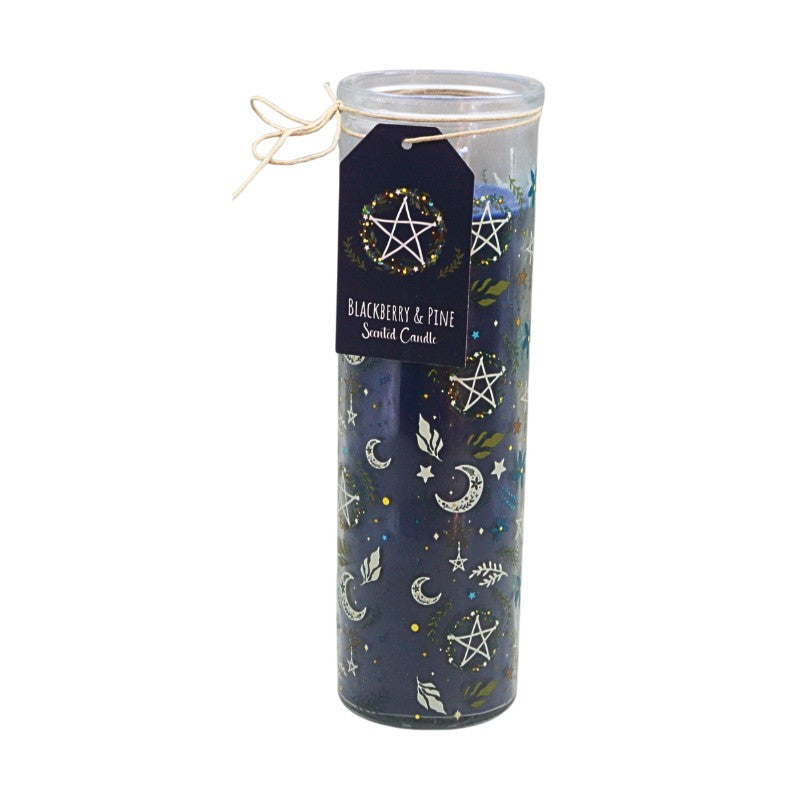A tall glass jar candle with a clear lid and a hanging tag that reads 'Blackberry & Pine Scented Candle.' The candle wax is dark blue with printed celestial motifs including stars, moons, and leaves, and the tag features a white pentagram design.