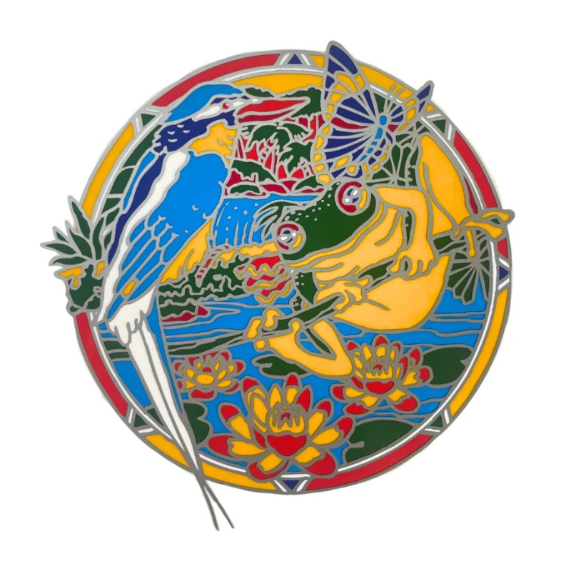 A colorful circular sticker featuring a blue kookaburra and a green frog in a natural scene with lotus flowers, outlined in silver metal on a white background.