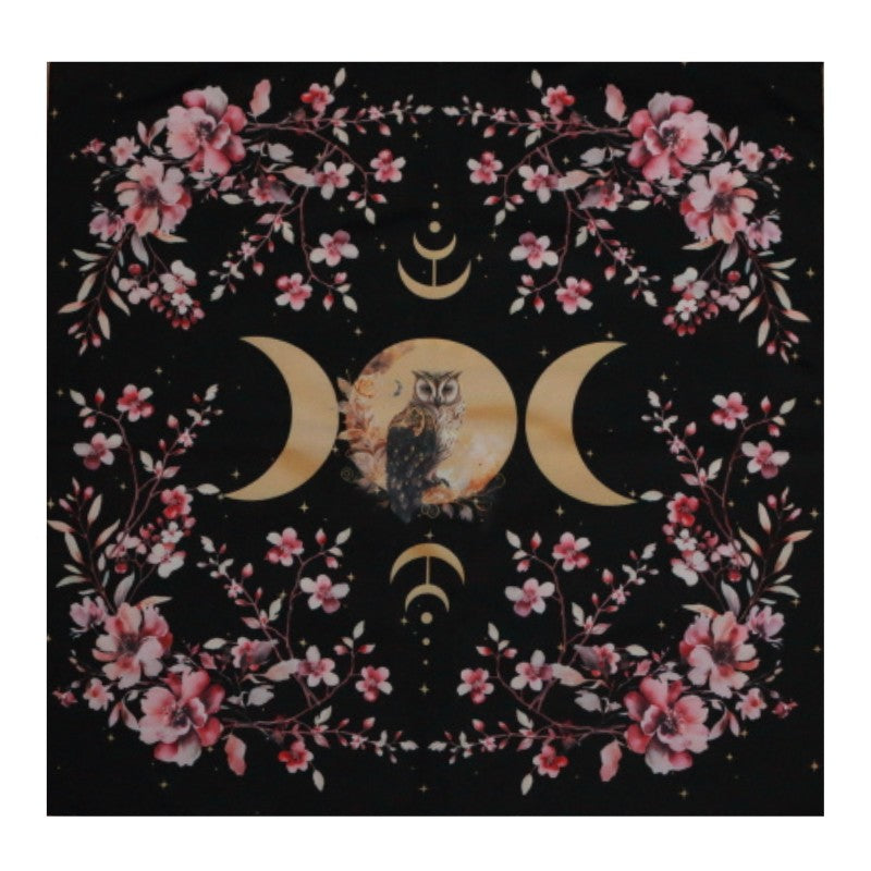 black tarot cloth with gold triple moon and owl design with floral borders.