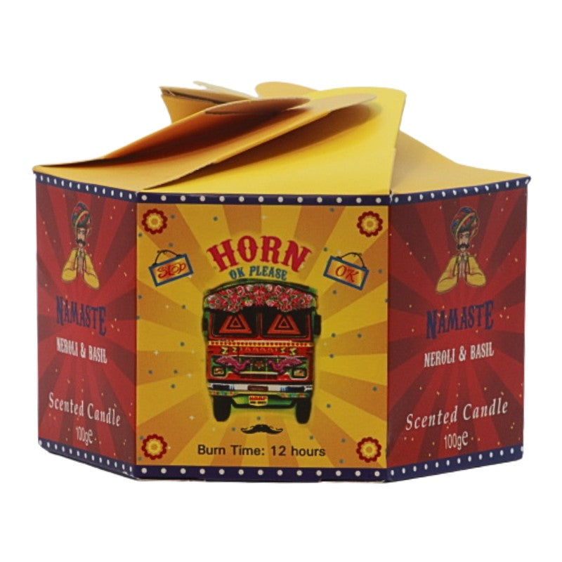 yellow and red candle box with a colourful bus on the front