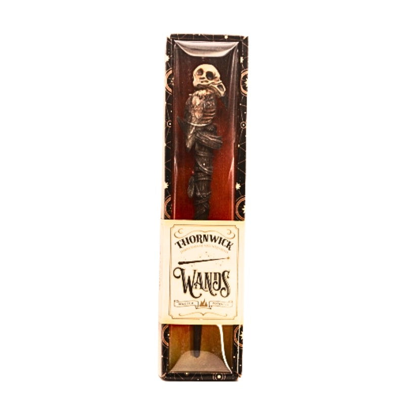 costume magic wand with a raven skull on top in display box