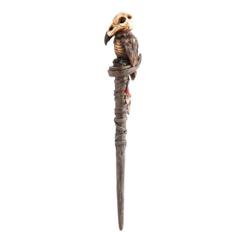 costume magic wand with a raven skull on top
