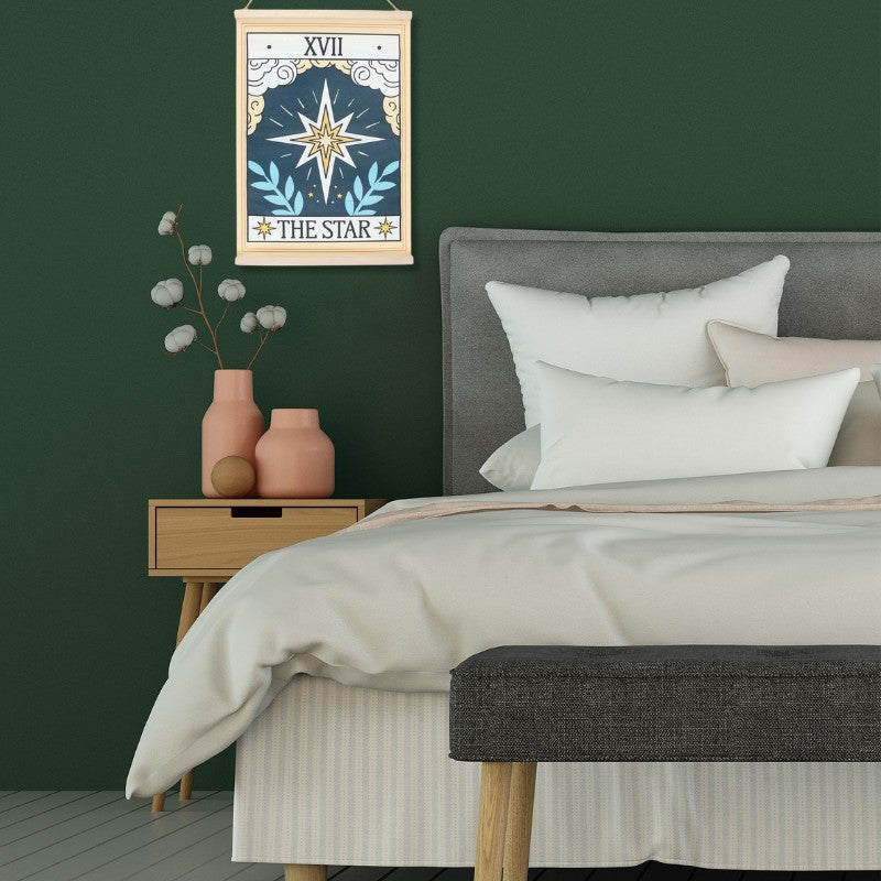 vintage tarot print wall hanging of "The Star" on a bedroom wall