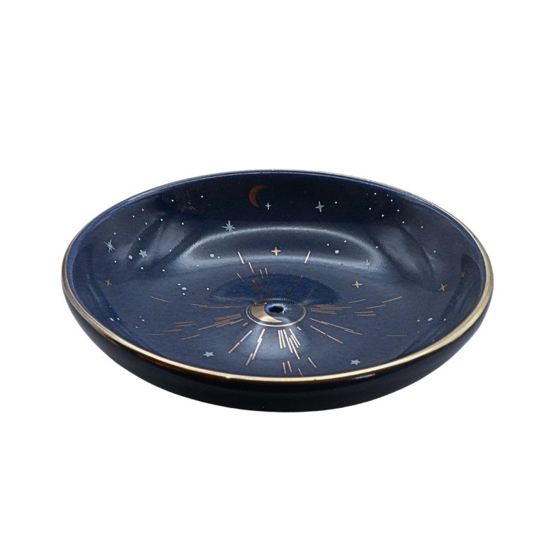Decorative incense bowl with celestial design on a white background