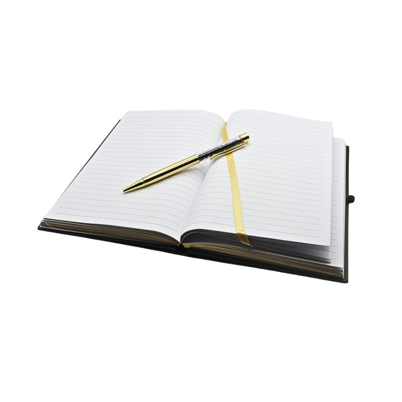 Open notebook with a pen on a white background