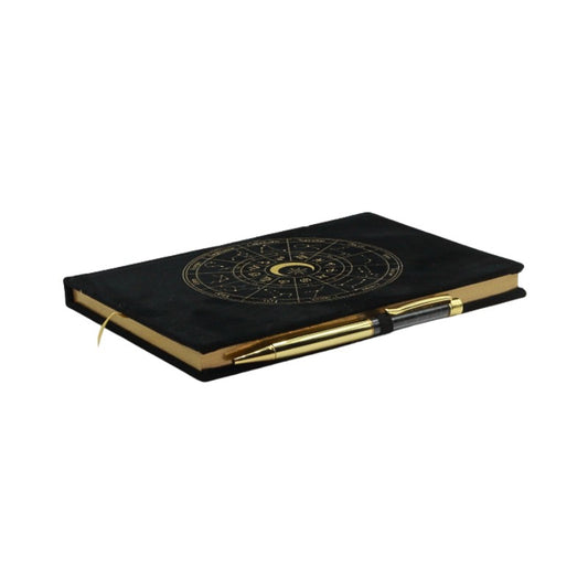 Black notebook with gold accents and celestial design on a white background