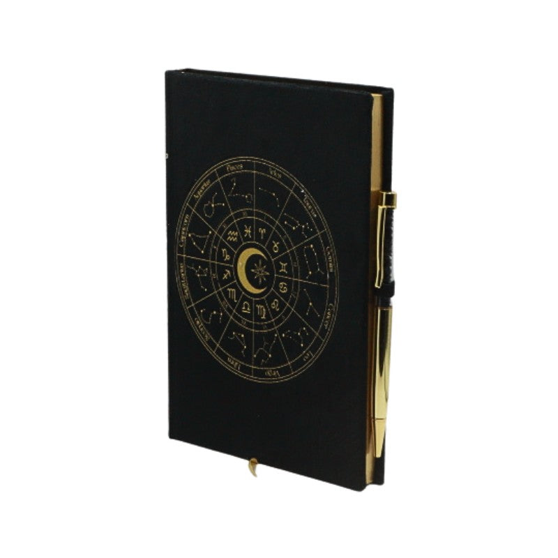 Black notebook with gold astrological design on a white background