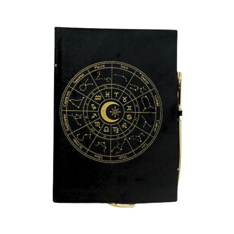 Black notebook with gold zodiac design on a white background