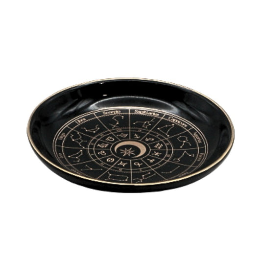Black plate with zodiac design on a white background