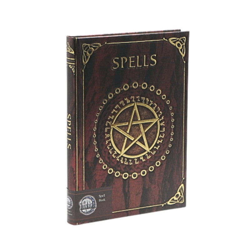 Book titled 'Spells' with a pentagram design on a white background