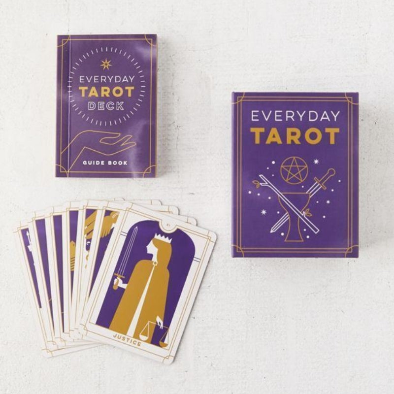 everyday tarot mini tarot deck showing the guidebook with cards laid out on table