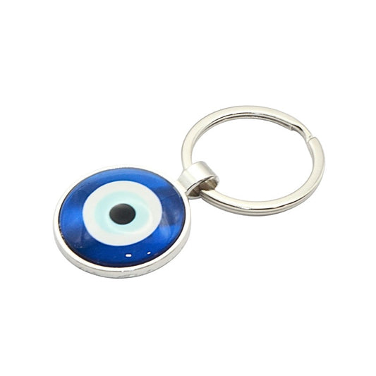 Keychain with blue eye design on a white background