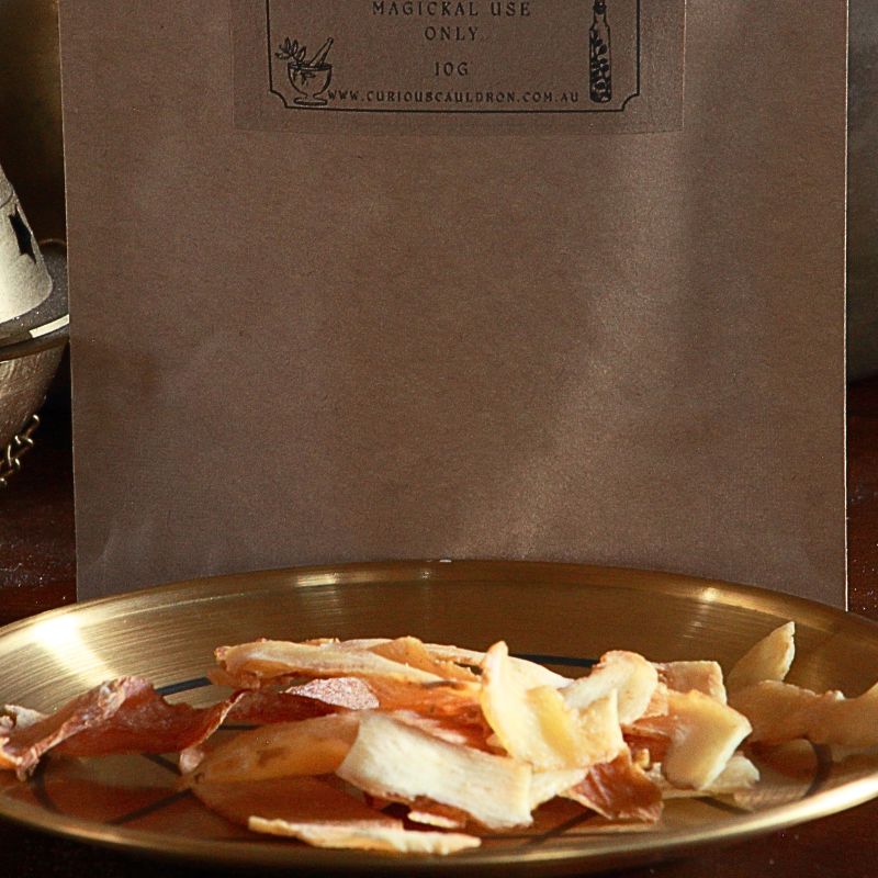 Dried Solomon's Seal on a gold plate with a brown paper bag in the background