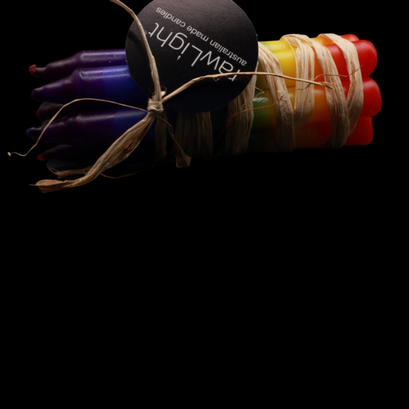 A bundle of rainbow candles tied with raffia