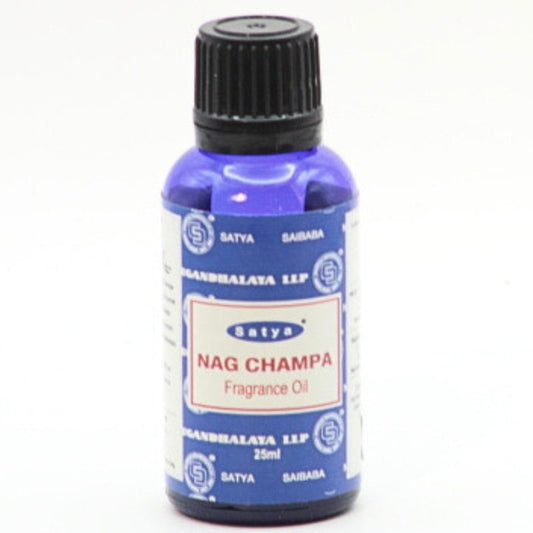 blue bottle of fragrance oil by Satya- Nag Champa