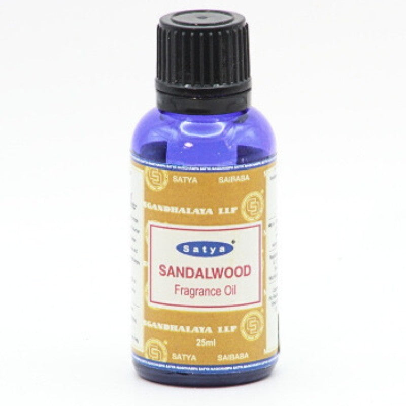 blue bottle of satya fragrance oil- sandalwood scent