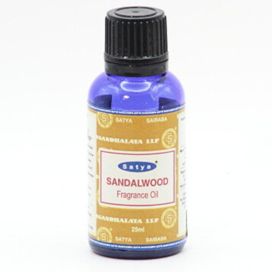 blue bottle of satya fragrance oil- sandalwood scent