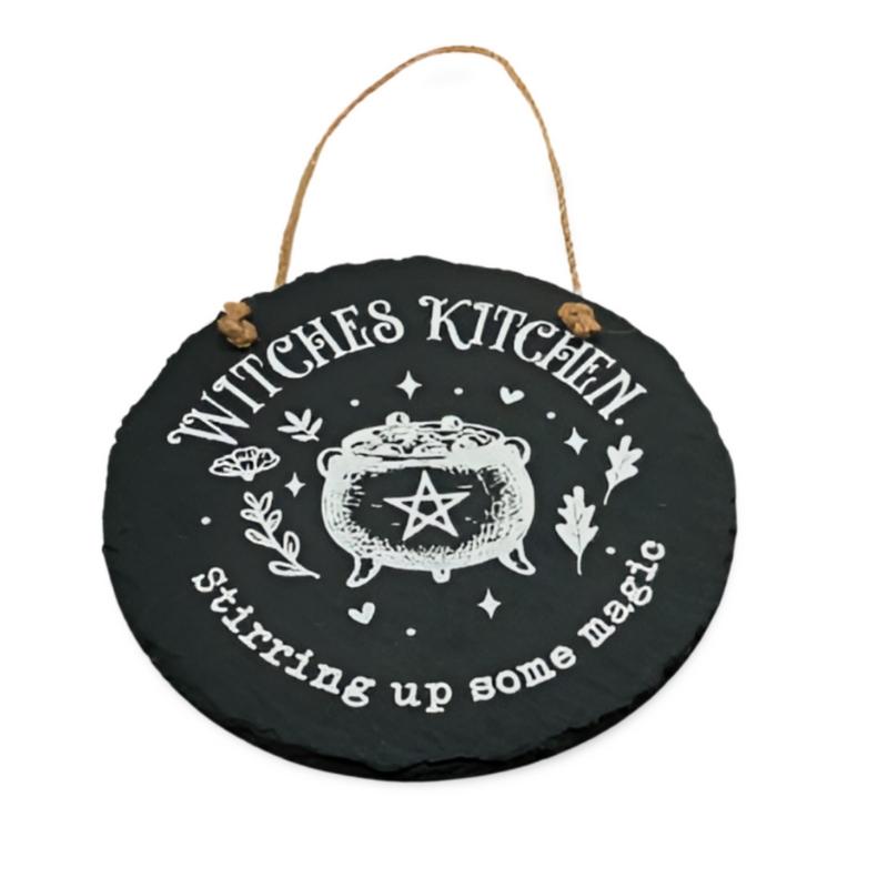 black slate sign with a rope handle. White cauldron painted on the front of the sign with a pentagram