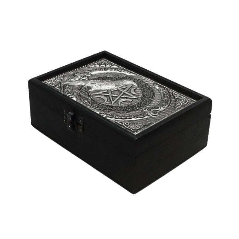 Black jewelry box with silver pentagram and raven design on a white background