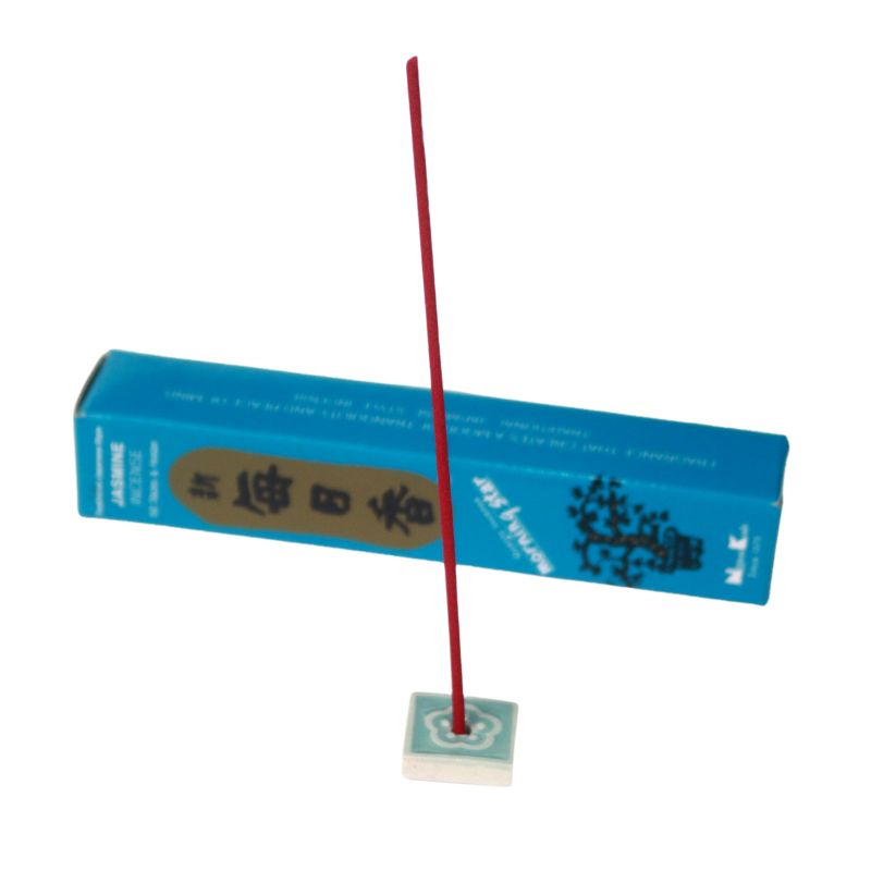 rectangle box of japanese morning star "jasmine" incense sticks next to a blue and white tileincense holder