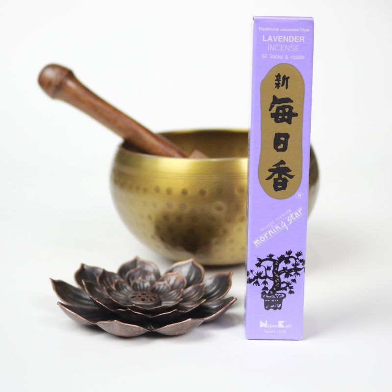 rectangle box of japanese morning star "lavender" incense sticks next to a lotus incense holder and brass singing bowl